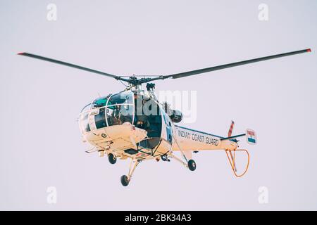Goa, India - February 18, 2020: Helicopter Of Indian Coast Guard Patroling Situation Stock Photo