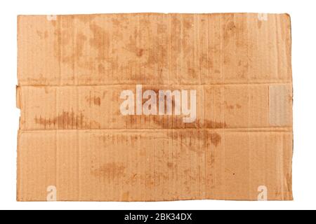 blank flat dirty sheet of yellow cardboard - mockup for homeless placard, isolated on white background Stock Photo