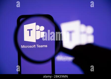 LONDON, UK - May 1st 2020: Microsoft teams logo under a magnifying glass Stock Photo