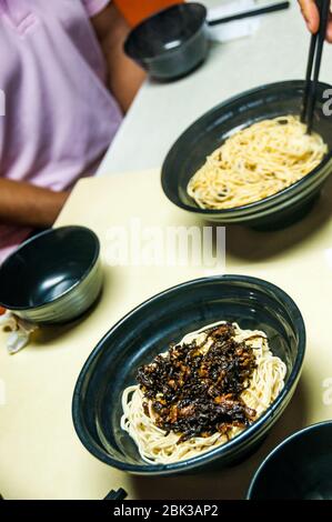 Scallion oil noodles at a local restaurant down an alleyway just off Shanghai’s Huai Hai Road. Stock Photo