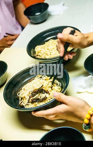 Scallion oil noodles at a local restaurant down an alleyway just off Shanghai’s Huai Hai Road. Stock Photo