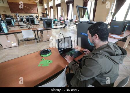 TWENTY 3D PRINTERS ARE MAKING PROTECTIVE VISORS IN A TOWN HALL IN PARIS Stock Photo