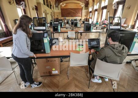 TWENTY 3D PRINTERS ARE MAKING PROTECTIVE VISORS IN A TOWN HALL IN PARIS Stock Photo