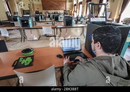 TWENTY 3D PRINTERS ARE MAKING PROTECTIVE VISORS IN A TOWN HALL IN PARIS Stock Photo