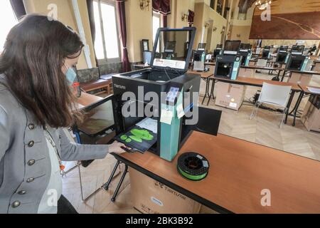 TWENTY 3D PRINTERS ARE MAKING PROTECTIVE VISORS IN A TOWN HALL IN PARIS Stock Photo