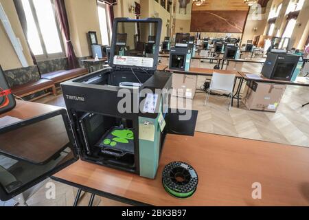 TWENTY 3D PRINTERS ARE MAKING PROTECTIVE VISORS IN A TOWN HALL IN PARIS Stock Photo