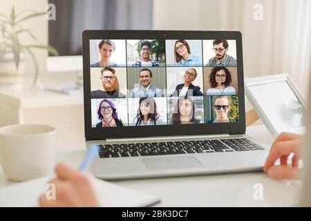 Online conference of colleagues through a laptop. Video call for training. Educational webinar chat between different people. Team meeting. Stock Photo