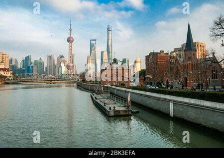 View along Suzhou Creek from the Zhapu Road bridge towards Garden Bridge and with the Pudong skyline in the background. Stock Photo