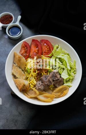 Soto Mie Bogor,traditional noodles soup from West Java ,Indonesia Stock Photo