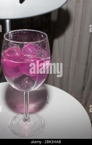 empty glass with ice cubes on white background Stock Photo