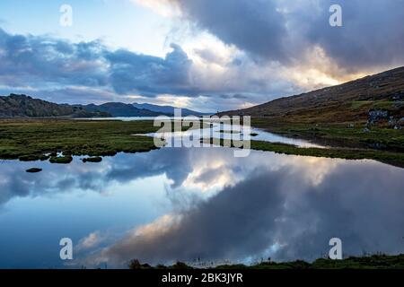 Reflective clouds in the water with the view towards Kishorn Wester Ross, Scotland UK Europe Stock Photo
