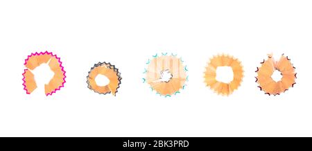 Row of three different color wood pencil shavings placed on a white isolated background Stock Photo
