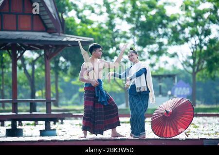 Thailand music, dancing women and man in national style dress costume : thailand dance Stock Photo