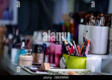 Professional makeup brushes set closeup near salon mirror,Makeup tools in a wedding Stock Photo