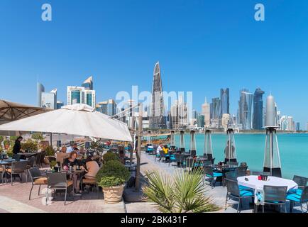 Al Mourjan restaurant on the Corniche with the skyline of the West Bay Central Business District behind, Doha, Qatar, Middle East Stock Photo