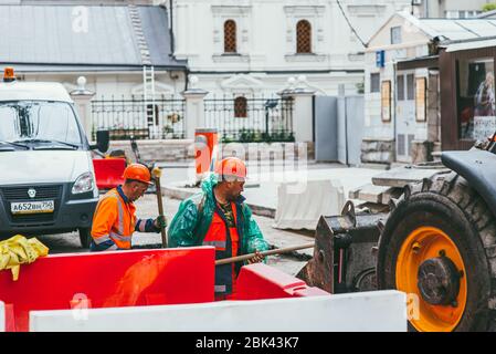 Moscow, Russia - JULY 7, 2017: men workers repairing the road on the streets of Moscow Stock Photo