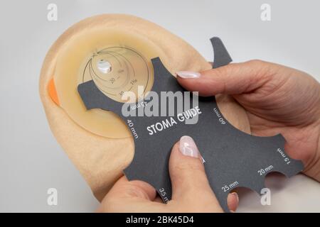 Top view on colostomy bag needed after colostomy surgery - colon cancer treatment. Ostomy bag with filter in skin color. Medical theme. Stoma bag and Stock Photo