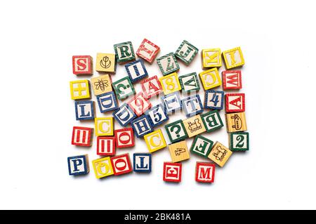 Alphabet characters written with wooden letters, education abstract background top view Stock Photo