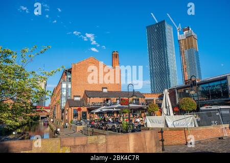 Manchester, England - July 22, 2018: People dining at restaurant in Castlefield district Stock Photo