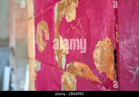 Old clay tiled stove with spots without paint. Stock Photo