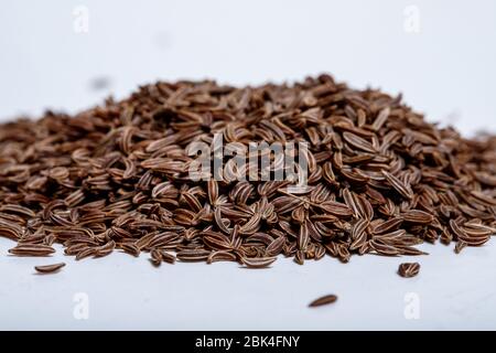 Pile of cumin seeds isolated on white background Stock Photo