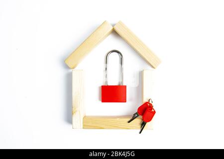 Home security. Smart house. Online authorization code. Wooden house with closed red padlock on plank inside, copy space Stock Photo