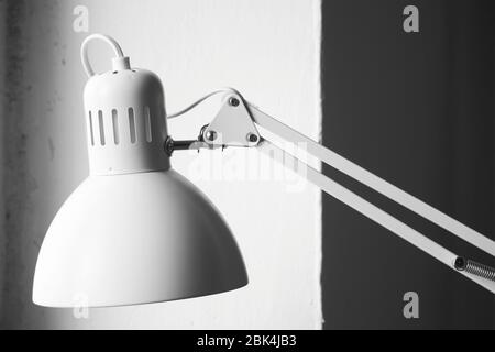 White desk lamp on black and white background, BW concept Stock Photo