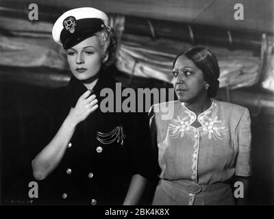 RITA HAYWORTH and EVELYN ELLIS in THE LADY FROM SHANGHAI 1947 director / screenplay ORSON WELLES based on novel by Sherwood King gowns Jean Louis Columbia Pictures Stock Photo