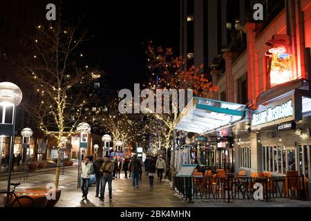 Denver, Colorado - December 31, 2019: Unidentified people walking on the 16th street mall on New years eve in Denver, Colorado Stock Photo