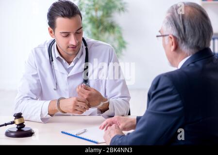 Male doctor in courthouse meeting with the lawyer Stock Photo