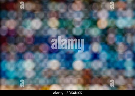 LED illuminated bokeh background on frame arrangement system. Abstract defocused illuminated backdrop with light bokeh on rectangular grid pattern. Stock Photo