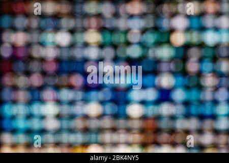 LED illuminated bokeh background on frame arrangement system. Abstract defocused illuminated backdrop with light bokeh on rectangular grid pattern. Stock Photo