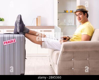 The man going on vacation with fragile suitcases Stock Photo