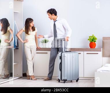 The wife seeing her husband off to business trip Stock Photo