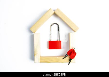 Home security. Smart house. Online authorization code. Wooden house with closed red padlock on plank inside, copy space Stock Photo