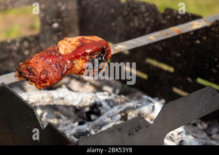 Grilling marinated shashlik on a grill. Shashlik is a form of Shish kebab  popular in Eastern, Central Europe and other places. Shashlyk meaning skewer  Stock Photo - Alamy