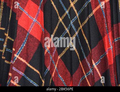 Black, red, yellow, blue plaid A-line pleated skirt. Wool blend with polyester & acrylic. Made in the USA in the 1980's. Stock Photo