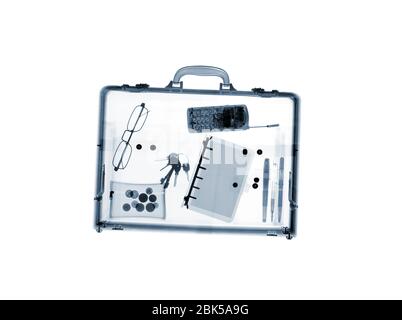 Briefcase with various items, X-ray. Stock Photo