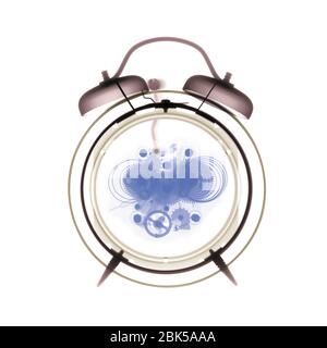 Alarm clock, coloured X-ray. Stock Photo