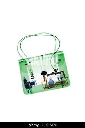 Handbag with various items, coloured X-ray. Stock Photo