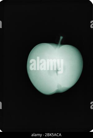 Apple, coloured X-ray. Stock Photo