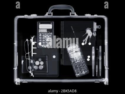 Briefcase with various items, X-ray. Stock Photo
