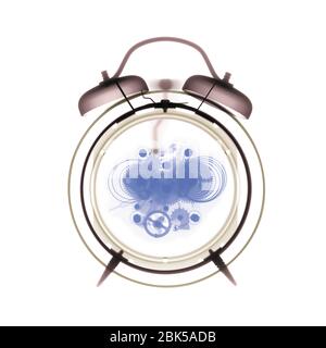 Alarm clock, coloured X-ray. Stock Photo