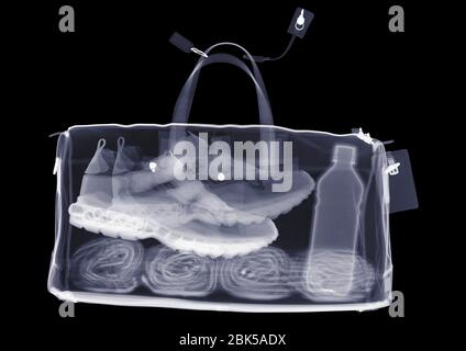 Sports bag with trainers towel and water, X-ray. Stock Photo