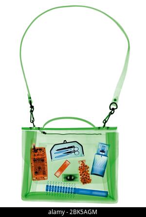 Woman's handbag and accessories, coloured X-ray. Stock Photo
