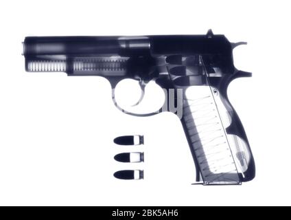 Handgun and bullets, X-ray. Stock Photo