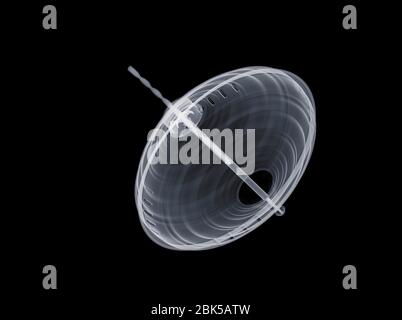 Mechanical spinning top at an angle, X-ray. Stock Photo