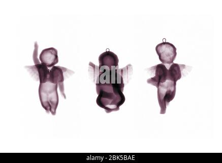 Glass angel tree ornaments, coloured X-ray. Stock Photo