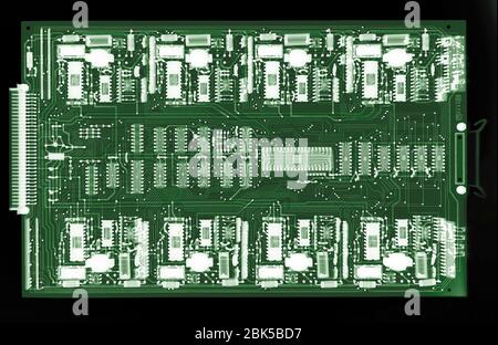 Computer circuit board, coloured X-ray. Stock Photo