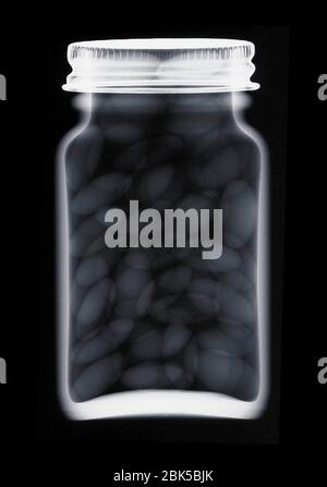 Glass jar of pills, X-ray. Stock Photo